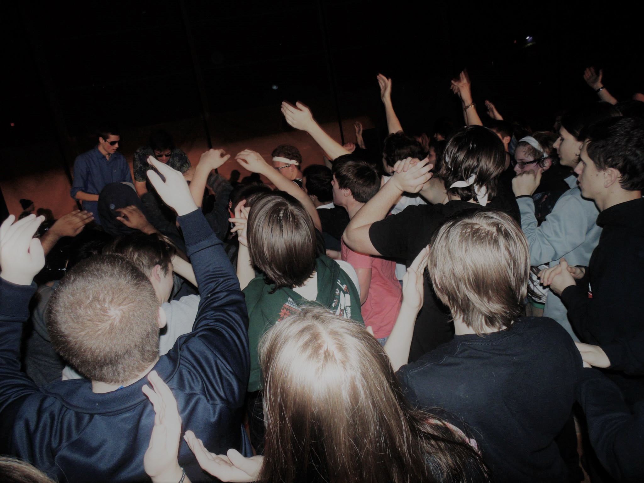 a crowd dancing at a concert